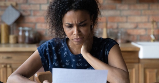 woman looking at insurance form