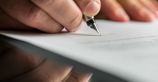 hand signing insurance form