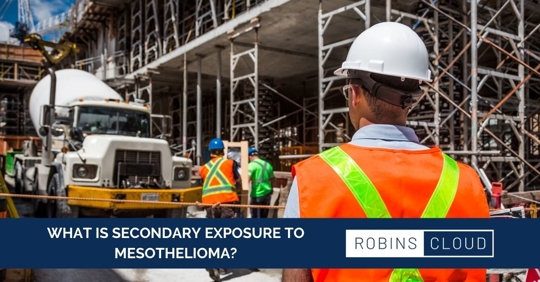 Man looking at construction site with a banner with text reading "What is secondary exposure to mesothelioma?"