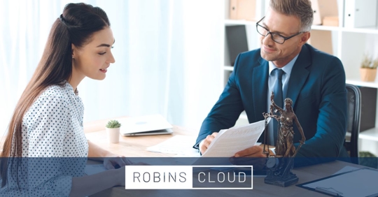 Woman having a consultation with a male lawyer.