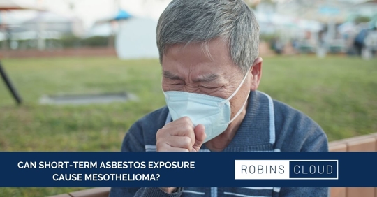 Man coughing with mask on