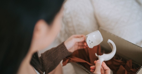 woman looking at broken gift